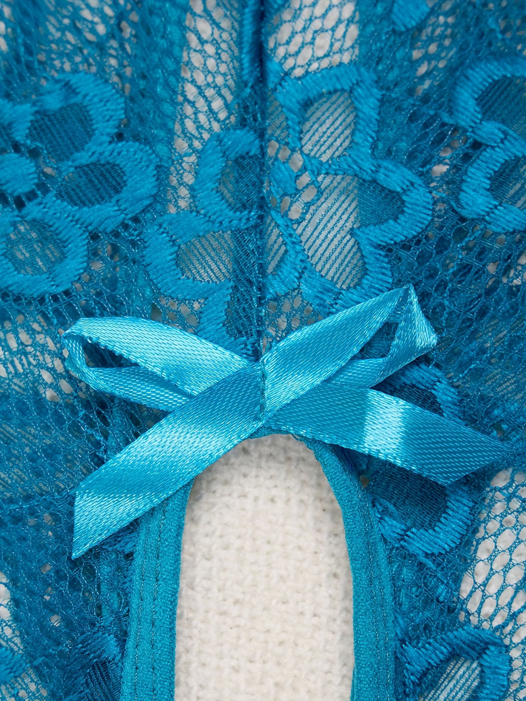 Body azul transparente com laços